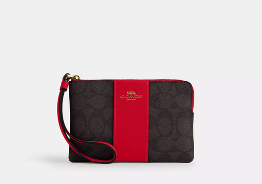 Coach Corner Zip Wristlet In Signature Canvas